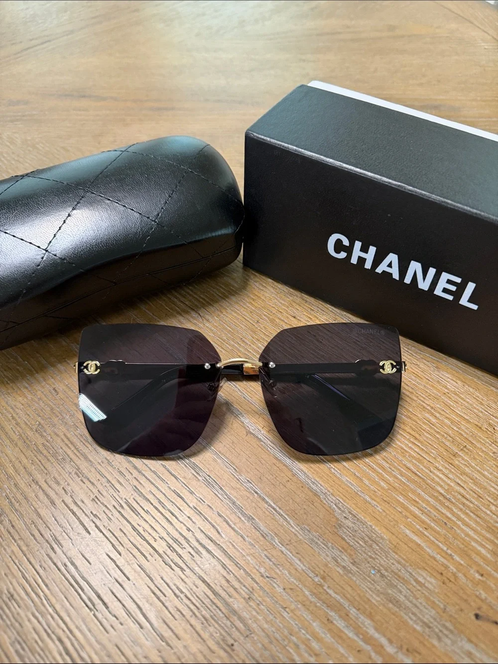 CHANEL Rimless Square Sunglasses with Dark Gradient Lenses and Gold Accents